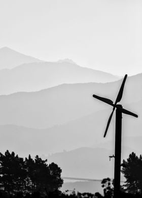 Windmill with mountain sin the distance