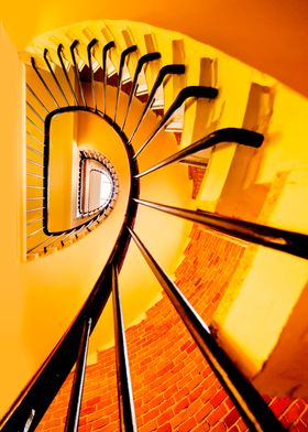 Spiral staircase in yellow and orange colors