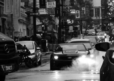 Chevrolet Camaro lighting up a steaming manhole on a Sa ... 