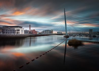 Sunrise and sweeping clouds at the River Tawe and the M ... 