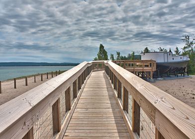 Freshly constructed, wooden boardwalk along a sandy bea ... 
