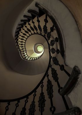 Ornamented spiral staircase in brown tones