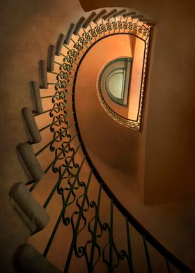 Half spiral staircase in brown and orange tones.