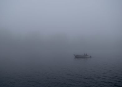 A morning fisherman traveling the channel into Lake Mic ... 