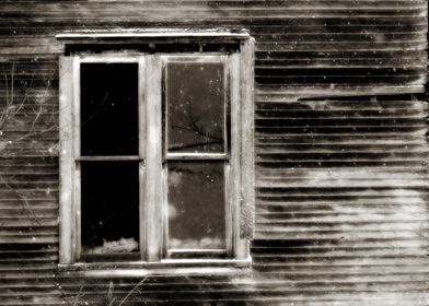 window into an old abandoned house.