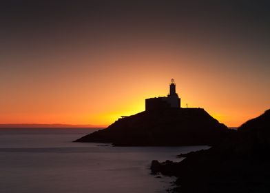 Daybreak at Mumbles lighthouse, an iconic structure in  ... 