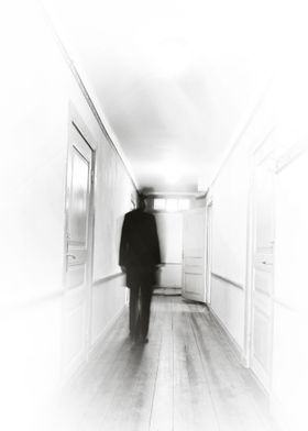 person in motion blur in bright corridor.