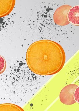 Oranges and grapefruit on a green and grey background.