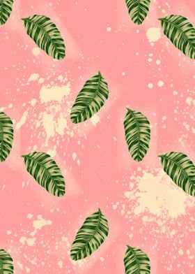 Green leaves pattern on a pink background with splatter ... 