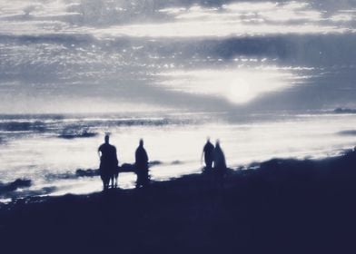 watching sunset at the beach in black and white