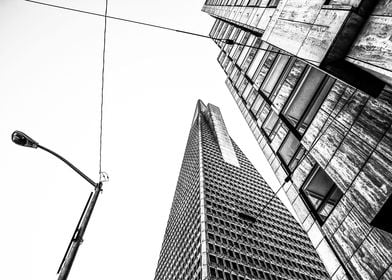 pyramid building and modern building in black and white ... 