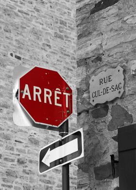 Buildings and a stop sign in French play tricks on the  ... 