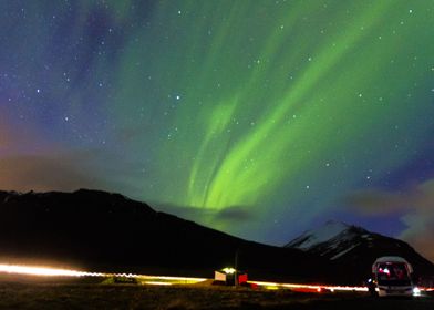 The Aurora Borealis over mountains in Iceland