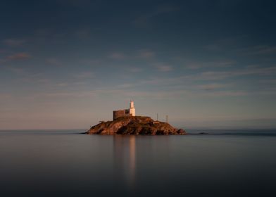 A calm full tide evening at Mumbles Lighthouse in Swans ... 