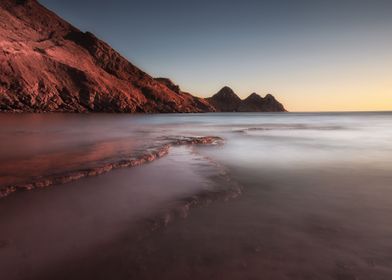 Moody sunset at Three Cliffs Bay on the Gower peninsula ... 