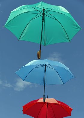 Colored umbrellas in flight