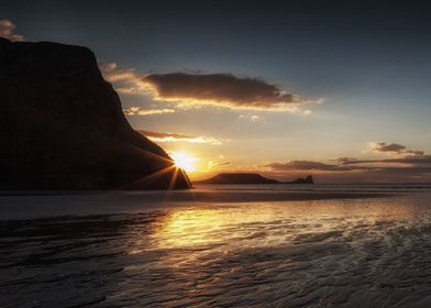 Sunset and wet sand at Worms Head Gower peninsula