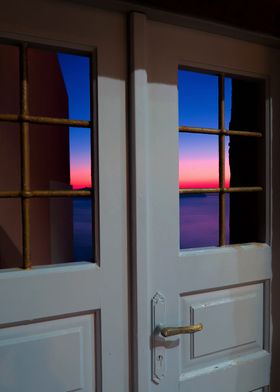 Sunset through the broken door