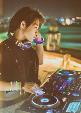 Portrait of female DJ playing live