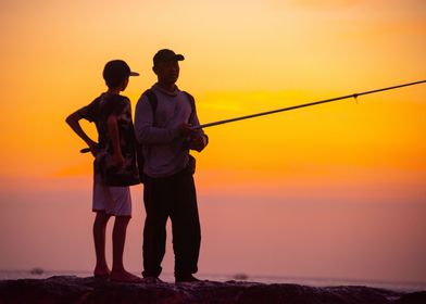 boy and dad fishing