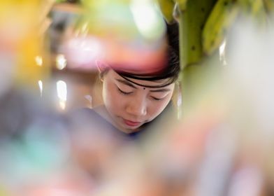 A chakma girl at her shop.