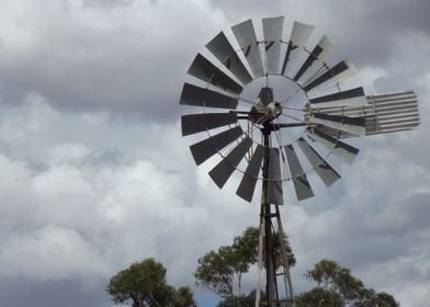 Windmill with grey sky