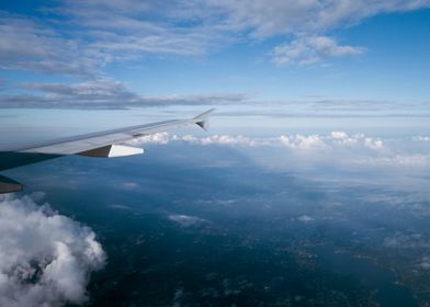 wing plane with sky clouds