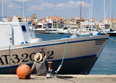 Man painting his boat