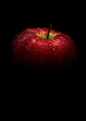Fresh red apple in black