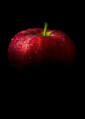 Fresh red apple in black