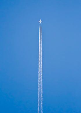 Airplane over blue