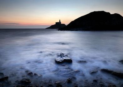 Mumbles lighthouse in silh