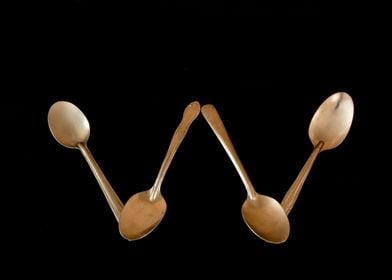 Letter W made of spoons 
