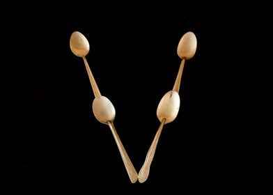 Letter V made of spoons 