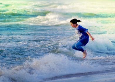 girl jumping at sea waves
