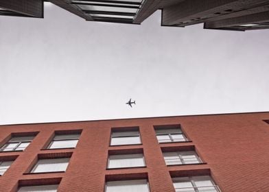 Airplane Between Buildings