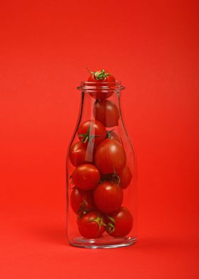 Fresh tomato bottle on red