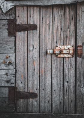 Old door with rusty bolt