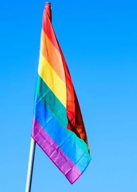 Gay rainbow flag blue sky