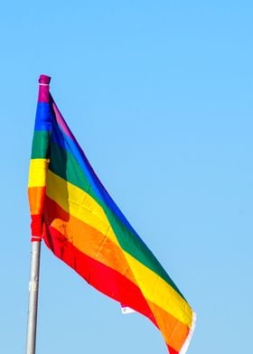 Gay rainbow flag blue sky