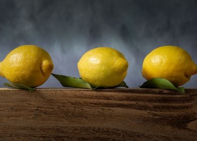 Three lemons with leaves