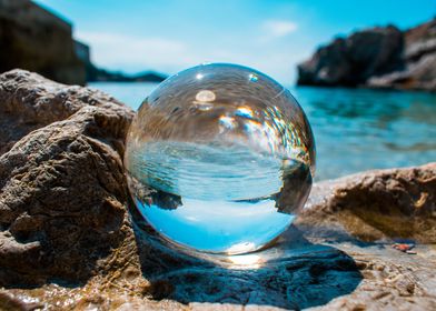 Glass ball on the rocks