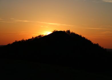 sunset on hill silhouette
