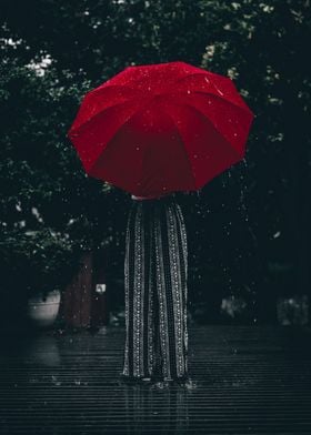 woman holding red umbrella