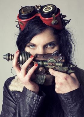 girl holding steampunk gun