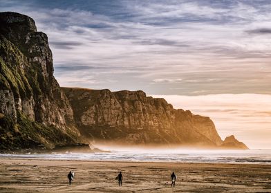 Three Surfers