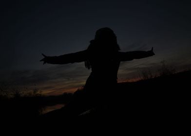 silhouette of woman at sun