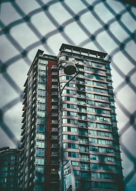 Skyscraper behind fence