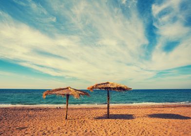 Two Straw Beach Umbrellas 