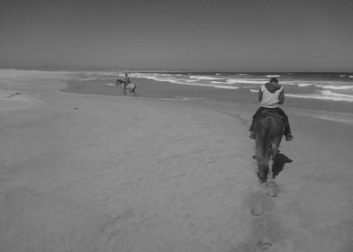 Horse Riders On The Beach